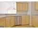 This kitchen features wooden cabinets and stainless steel appliances at 115 Sunderland Cir, Fayetteville, GA 30215