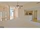 Open concept living area with hardwood floors, neutral carpet and view into kitchen area at 115 Sunderland Cir, Fayetteville, GA 30215