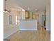 Open concept living area with hardwood floors, neutral carpet and view into kitchen area at 115 Sunderland Cir, Fayetteville, GA 30215