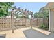 A wooden pergola and wooden fence create a pleasant shaded area on the back patio at 115 Sunderland Cir, Fayetteville, GA 30215