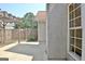 Back patio with a decorative wooden fence and wooden pergola at 115 Sunderland Cir, Fayetteville, GA 30215
