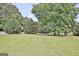 Beautiful, large, grassy backyard with well-manicured landscaping at 115 Sunderland Cir, Fayetteville, GA 30215