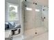 Modern bathroom featuring a spacious glass-enclosed shower, bench seating, and stylish tile work at 38 Avian Way # 126B, Auburn, GA 30011