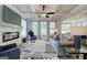 Spacious living room with a fireplace, coffered ceiling, and open concept layout to the kitchen at 38 Avian Way # 126B, Auburn, GA 30011