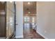 Home entryway featuring hardwood floors, a glass front door, and an open layout at 40 Avian Way # 127B, Auburn, GA 30011