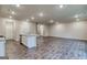 Open floorplan kitchen with center island, stainless appliances, and hardwood floors at 40 Avian Way # 127B, Auburn, GA 30011