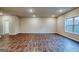 Spacious living room featuring hardwood floors, neutral walls, and natural light at 40 Avian Way # 127B, Auburn, GA 30011