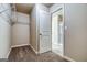 Walk-in closet with wire shelving, neutral carpet, and access to primary bathroom at 40 Avian Way # 127B, Auburn, GA 30011
