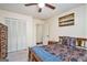 Comfortable bedroom featuring a closet, ceiling fan and warm-toned walls at 1911 Geyser Trce, Lawrenceville, GA 30044
