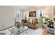 Bright living room with hardwood floors, a decorative rug, and lots of natural light at 1911 Geyser Trce, Lawrenceville, GA 30044