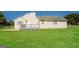 Backyard featuring a deck, a large yard, and an exterior view of the home at 11102 Hunters Ln, Hampton, GA 30228