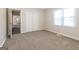 Bedroom with neutral carpeting and a large window for natural light at 11102 Hunters Ln, Hampton, GA 30228