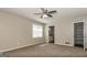 Bedroom featuring neutral carpeting, a ceiling fan, and natural lighting at 11102 Hunters Ln, Hampton, GA 30228
