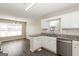 Bright kitchen with stainless steel appliances, granite countertops, and modern flooring at 11102 Hunters Ln, Hampton, GA 30228