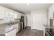 Well-lit kitchen with stainless steel appliances, granite countertops, and ample storage at 11102 Hunters Ln, Hampton, GA 30228