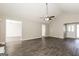 Bright living room featuring vaulted ceiling, neutral walls, and modern gray floors at 11102 Hunters Ln, Hampton, GA 30228