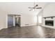 Spacious living room featuring a fireplace, neutral walls, and modern gray floors at 11102 Hunters Ln, Hampton, GA 30228