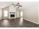 Inviting living room featuring a fireplace, neutral walls, and modern gray floors at 11102 Hunters Ln, Hampton, GA 30228