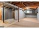 This basement features carpet flooring and gray painted walls at 115 Club Cir, Stockbridge, GA 30281