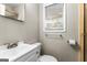 Bathroom featuring neutral paint, a toilet, sink, mirror, and a shower at 115 Club Cir, Stockbridge, GA 30281