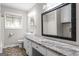 Bathroom featuring a large mirror, granite counters, and modern fixtures at 115 Club Cir, Stockbridge, GA 30281