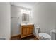 Neutral bathroom featuring a wooden vanity at 115 Club Cir, Stockbridge, GA 30281