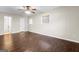 Spacious primary bedroom with vinyl floors, neutral paint and a bathroom ensuite at 115 Club Cir, Stockbridge, GA 30281
