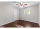 Neutral bedroom with ceiling fan, one window and wood-look floors at 115 Club Cir, Stockbridge, GA 30281