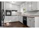 Bright kitchen featuring white cabinetry, subway tile backsplash, and modern appliances at 115 Club Cir, Stockbridge, GA 30281