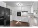 Bright kitchen featuring white cabinetry, stainless steel appliances, and stylish countertops at 115 Club Cir, Stockbridge, GA 30281