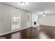 Spacious living room features a white brick fireplace and large windows at 115 Club Cir, Stockbridge, GA 30281