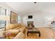 Bright living room with a stone fireplace, hardwood floors, and a vaulted ceiling at 2031 Dennis Pl, Buford, GA 30519