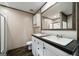 Bathroom featuring double sinks, white vanity and a large mirror at 273 Ridge Dr, Villa Rica, GA 30180
