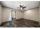 Bedroom with hardwood floors and view to ensuite bathroom with soaking tub at 273 Ridge Dr, Villa Rica, GA 30180