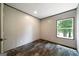 Bedroom with a hardwood floor, window and base trim at 273 Ridge Dr, Villa Rica, GA 30180