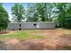 Exterior of the home showing the length of the structure on green grass at 273 Ridge Dr, Villa Rica, GA 30180