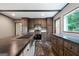 Modern kitchen featuring stainless steel appliances, wood cabinets, dark countertops and island with stainless steel sink at 273 Ridge Dr, Villa Rica, GA 30180