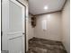 Laundry Room features an access door, storage cabinet and wire rack at 273 Ridge Dr, Villa Rica, GA 30180