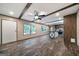 Open living room with luxury vinyl floors, ceiling fan, windows and access to kitchen with island at 273 Ridge Dr, Villa Rica, GA 30180