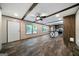Living room with luxury vinyl floors, ceiling fan, windows and access to kitchen with an island at 273 Ridge Dr, Villa Rica, GA 30180