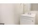 Bathroom featuring a white vanity sink with a chrome faucet and a mirror at 5575 Pine Gate Dr, Atlanta, GA 30349