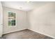 Bedroom featuring laminate flooring and a bright window at 5575 Pine Gate Dr, Atlanta, GA 30349