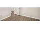 Bedroom with laminate flooring and an open doorway at 5575 Pine Gate Dr, Atlanta, GA 30349