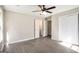 Bedroom featuring a ceiling fan, closets, and neutral walls at 5575 Pine Gate Dr, Atlanta, GA 30349