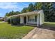 Inviting one-story home featuring vinyl siding and a cozy covered front porch at 5575 Pine Gate Dr, Atlanta, GA 30349