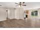 Open-concept living space with hardwood floors, seamlessly connecting the living room and kitchen at 5575 Pine Gate Dr, Atlanta, GA 30349