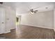 Spacious living room featuring hardwood floors, ceiling fan, and plenty of natural light at 5575 Pine Gate Dr, Atlanta, GA 30349