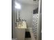 Neutral bathroom with tiled floors, shower with updated shower curtain, and single sink at 4109 Francis Ne St, Covington, GA 30014