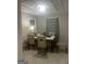 Inviting dining room with tiled flooring, dining table, and natural light from the window at 4109 Francis Ne St, Covington, GA 30014