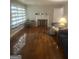 Cozy living room with beautiful hardwood floors, a decorative fireplace, and comfortable seating at 4109 Francis Ne St, Covington, GA 30014